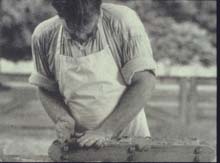 Pressing clay into a mold to make bricks - Used courtesy of Tom Walsh, Masonry Institute of St. Louis