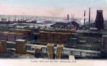 Postcard of a sawmill with lots of wood
